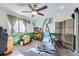 Bedroom featuring unique decor, ample natural light, and comfortable furnishings at 8210 Hoyt Ct, Arvada, CO 80005