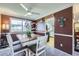 Inviting dining area with a rustic table, comfortable seating, and bright natural light at 8210 Hoyt Ct, Arvada, CO 80005