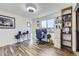 Bright home office with wood-look flooring and a large window offering plenty of natural light at 8210 Hoyt Ct, Arvada, CO 80005