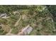 Aerial shot of a home site with surrounding trees, road access, and large lot at 2545 N State Highway 67, Sedalia, CO 80135