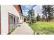 Charming backyard features a concrete patio, green grass and outdoor seating, ideal for gatherings at 2545 N State Highway 67, Sedalia, CO 80135