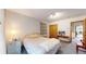 Comfortable bedroom boasts carpeted floors and light-filled windows overlooking the home's exterior at 2545 N State Highway 67, Sedalia, CO 80135