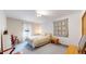 Comfortable bedroom boasts carpeted floors and light-filled windows overlooking the home's exterior at 2545 N State Highway 67, Sedalia, CO 80135