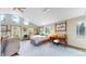 Bright bedroom with a ceiling fan, multiple windows and natural light, and ample workspace with views of the outdoors at 2545 N State Highway 67, Sedalia, CO 80135