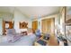 Inviting bedroom features comfortable seating, a spacious desk, and ample storage with closet spaces at 2545 N State Highway 67, Sedalia, CO 80135