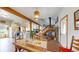 Dining room with hardwood floors open to the kitchen and living areas at 2545 N State Highway 67, Sedalia, CO 80135