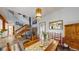 Comfortable dining room featuring wooden table, wood-burning stove, and stairs to the second floor at 2545 N State Highway 67, Sedalia, CO 80135