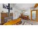 Cozy dining room with a wood-burning stove, brick hearth, and a rustic charm at 2545 N State Highway 67, Sedalia, CO 80135