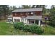 Two-story home featuring wood siding, daylight basement, and a well-maintained front yard at 2545 N State Highway 67, Sedalia, CO 80135