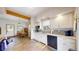 Kitchen boasts granite counters, stainless appliances, white cabinetry and flows into the dining area at 2545 N State Highway 67, Sedalia, CO 80135