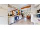 Bright kitchen featuring stainless steel appliances and open layout to the dining and living spaces at 2545 N State Highway 67, Sedalia, CO 80135