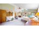 Inviting main bedroom featuring vaulted ceilings, a ceiling fan, and a separate work space at 2545 N State Highway 67, Sedalia, CO 80135