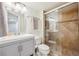 Modern bathroom featuring glass door shower, neutral paint, and vanity at 10520 W Fair Ave # A, Littleton, CO 80127