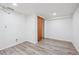 Bedroom offers neutral colors and modern wood-look vinyl flooring at 10520 W Fair Ave # A, Littleton, CO 80127