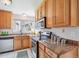 Well-equipped kitchen with granite countertops and stainless steel appliances at 10520 W Fair Ave # A, Littleton, CO 80127