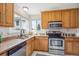 Well-equipped kitchen with granite countertops and stainless steel appliances at 10520 W Fair Ave # A, Littleton, CO 80127
