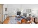 Cozy living room featuring a fireplace, plush rug, and neutral decor at 10520 W Fair Ave # A, Littleton, CO 80127