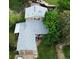 Aerial view of a two-story home with gray roof, well-maintained lawn, and a fenced backyard at 4677 S Salida St, Aurora, CO 80015