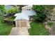 Aerial view of home with green lawn, newer roof and two car garage at 4677 S Salida St, Aurora, CO 80015