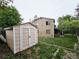 The backyard features a storage shed and a two-story home with a deck at 4677 S Salida St, Aurora, CO 80015
