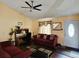 Cozy living room with vaulted ceilings, ceiling fan, and comfortable seating area at 4677 S Salida St, Aurora, CO 80015
