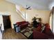 Bright living room featuring hardwood floors, a staircase, and comfortable seating at 4677 S Salida St, Aurora, CO 80015
