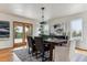 Elegant dining room with a wooden table, stylish chairs, and scenic views, perfect for gatherings at 8544 Burning Tree Trl, Franktown, CO 80116
