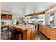 Spacious kitchen featuring a large island, stainless steel appliances, and a view of the outdoors at 8544 Burning Tree Trl, Franktown, CO 80116