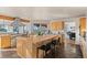 Spacious kitchen island with stone floors and mountain views at 8544 Burning Tree Trl, Franktown, CO 80116