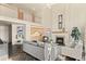 Open-concept living room featuring high ceilings, a fireplace, and a wet bar at 8544 Burning Tree Trl, Franktown, CO 80116