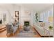 Bright living room with fireplace, hardwood floors, and contemporary decor at 8544 Burning Tree Trl, Franktown, CO 80116