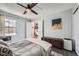 Bright bedroom with large window, closet access, and hardwood floors at 8391 W 90Th Pl # 101, Westminster, CO 80021