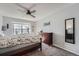 Comfortable bedroom with ceiling fan, spacious closet, and a peaceful ambiance at 8391 W 90Th Pl # 101, Westminster, CO 80021