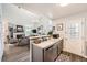 Open kitchen featuring stainless steel appliances and an adjacent Gathering room with fireplace at 8391 W 90Th Pl # 101, Westminster, CO 80021