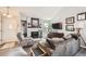 Comfortable living room with fireplace, ample seating, and lots of natural light at 8391 W 90Th Pl # 101, Westminster, CO 80021