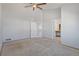 Spacious bedroom featuring neutral walls and carpet with convenient access to other rooms in the home at 10470 W 83Rd Ave, Arvada, CO 80005
