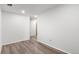 Clean bedroom with a window and wood-look flooring, providing a simple and comfortable space at 10470 W 83Rd Ave, Arvada, CO 80005