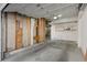 Spacious two-car garage with unfinished wall and room for storage shelves at 10470 W 83Rd Ave, Arvada, CO 80005