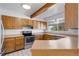Kitchen with stainless steel appliances, light wood cabinets and a bright window at 10470 W 83Rd Ave, Arvada, CO 80005