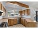 Kitchen with stainless steel appliances, oak cabinets, and a window over the sink at 10470 W 83Rd Ave, Arvada, CO 80005
