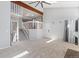 Living room featuring a staircase, neutral walls, a ceiling fan and carpeted floors at 10470 W 83Rd Ave, Arvada, CO 80005