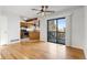 Living room with hardwood floors, a ceiling fan, and a sliding glass door to the outside at 10470 W 83Rd Ave, Arvada, CO 80005