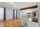 Bright living room featuring hardwood floors, a fireplace, and large windows with natural light at 10470 W 83Rd Ave, Arvada, CO 80005