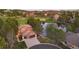 Stunning home with a large driveway, lovely landscaping, and beautiful view of the community golf course and pond at 3216 Country Club Pkwy, Castle Rock, CO 80108