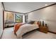 Bedroom with wood trim, a modern bed frame, wood bedside tables, and great natural light at 3216 Country Club Pkwy, Castle Rock, CO 80108
