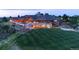 Luxury estate with covered patio and expansive lawn, beautifully landscaped at 3216 Country Club Pkwy, Castle Rock, CO 80108