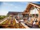 Inviting outdoor patio area with seating and fireplace, perfect for relaxing and enjoying the serene surroundings at 3216 Country Club Pkwy, Castle Rock, CO 80108