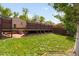 Well-maintained backyard features a multi-level deck and lush greenery at 3739 W 46Th Ave, Denver, CO 80211