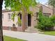 Charming home featuring an arched doorway, brick accents, and well-maintained landscaping at 3739 W 46Th Ave, Denver, CO 80211
