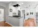 Bright kitchen featuring stainless steel appliances, quartz countertops, and custom white cabinetry at 3739 W 46Th Ave, Denver, CO 80211